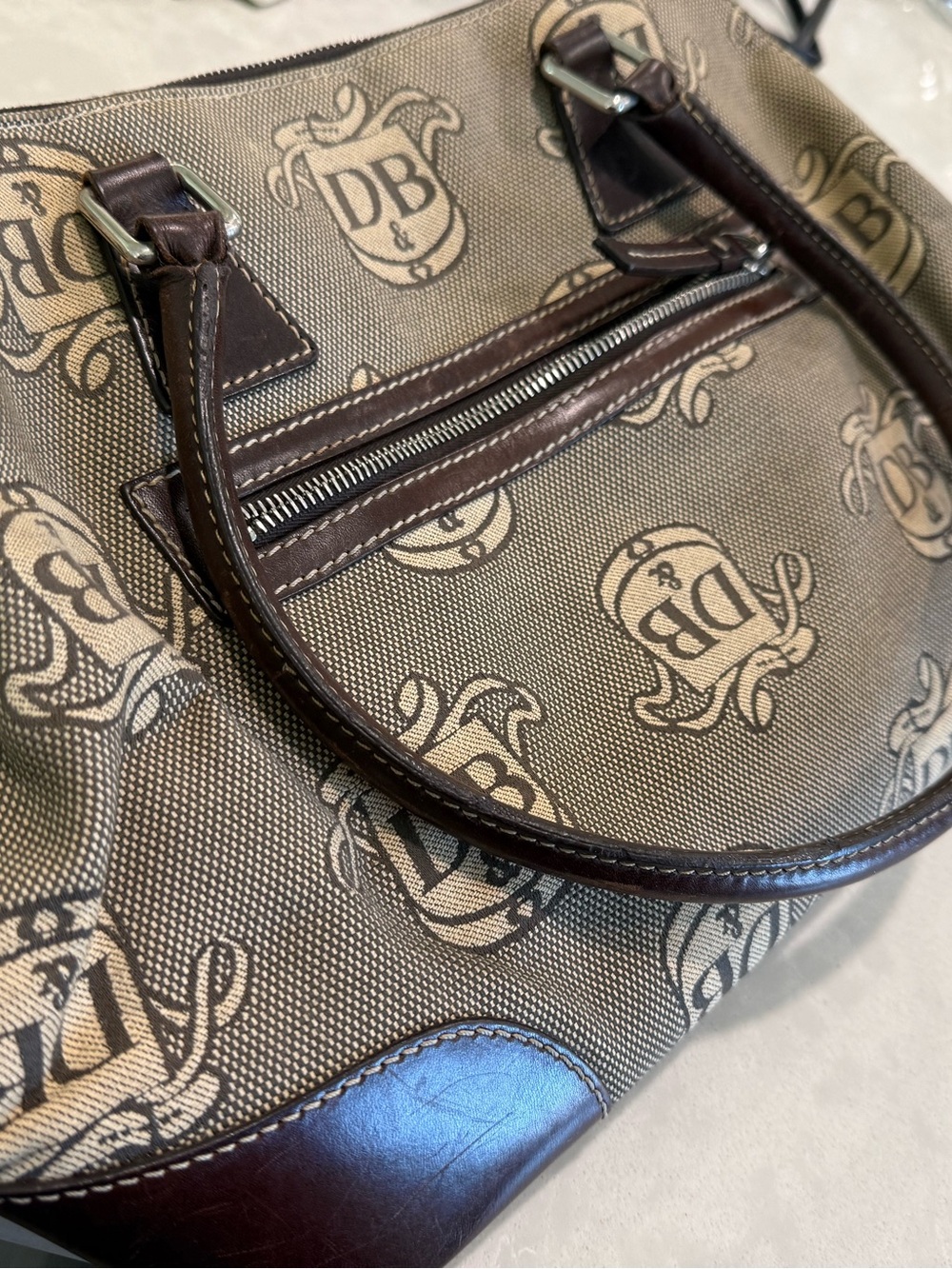 Dooney & Bourke Brown
Signature Donegal Crest Dome
Satchel, Used & Vintage - Picture 8 of 9